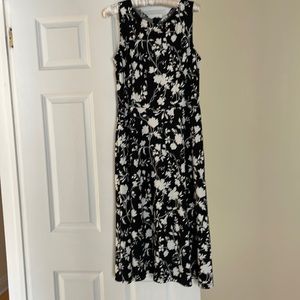 Black and white floral design waist Talbots dress. 2 side pockets, zip back.
